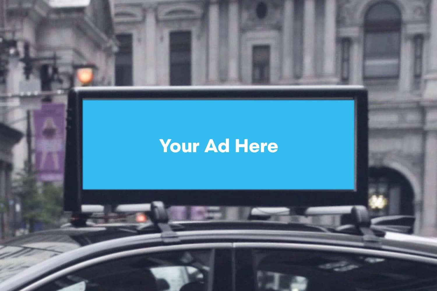 A digital display mounted on the roof of a car.